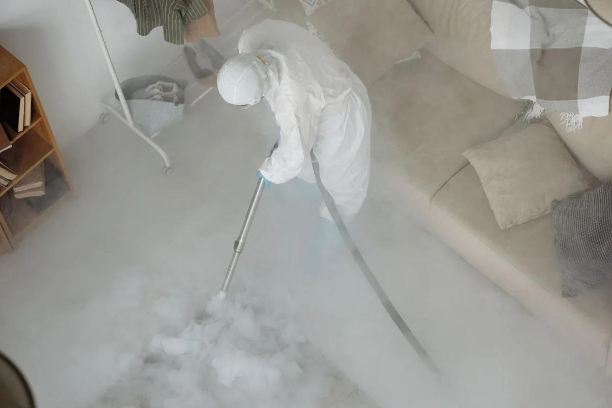 Biohazard cleanup technician in protective equipment, North Orange, Orlando, FL